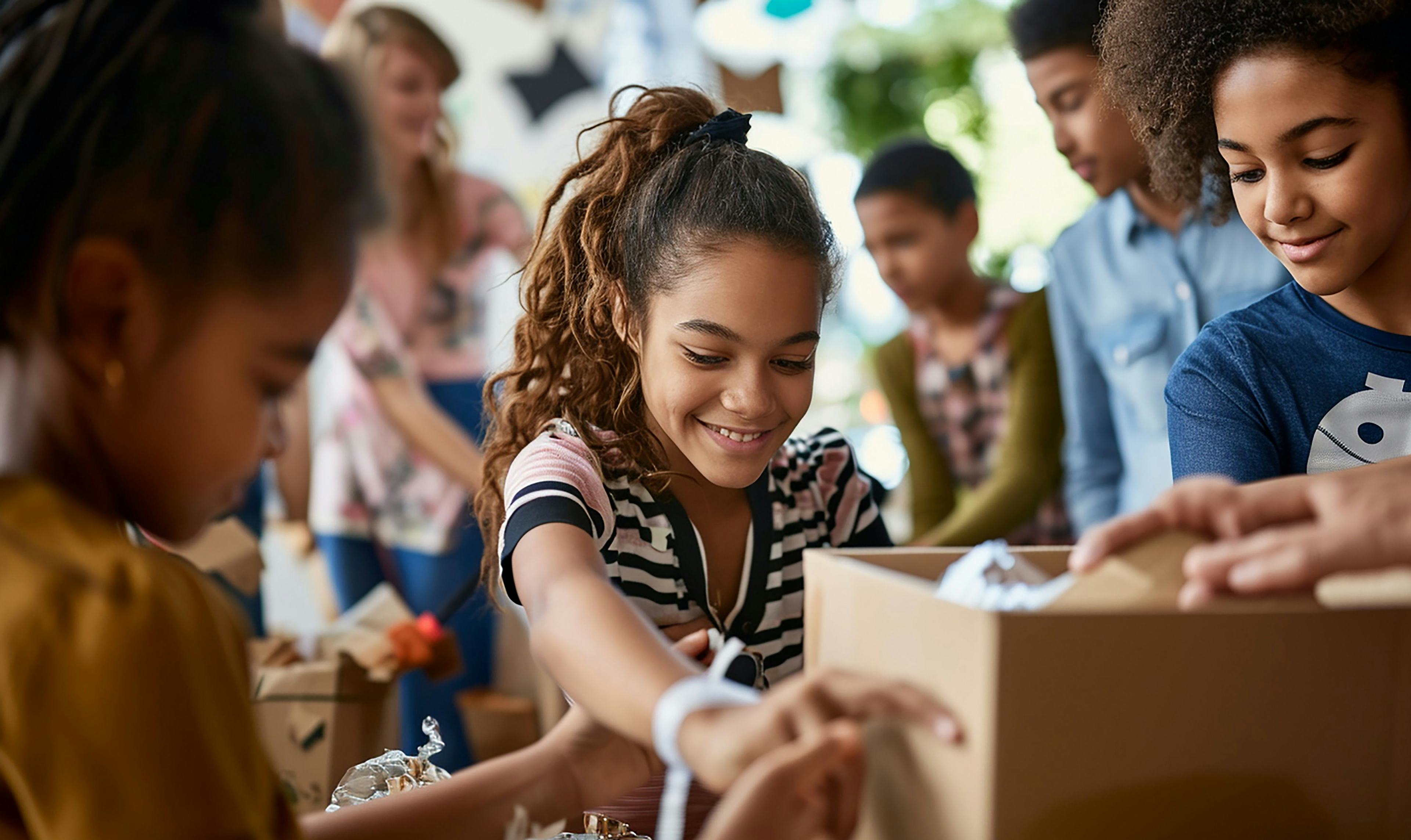 Kids helping volunteer