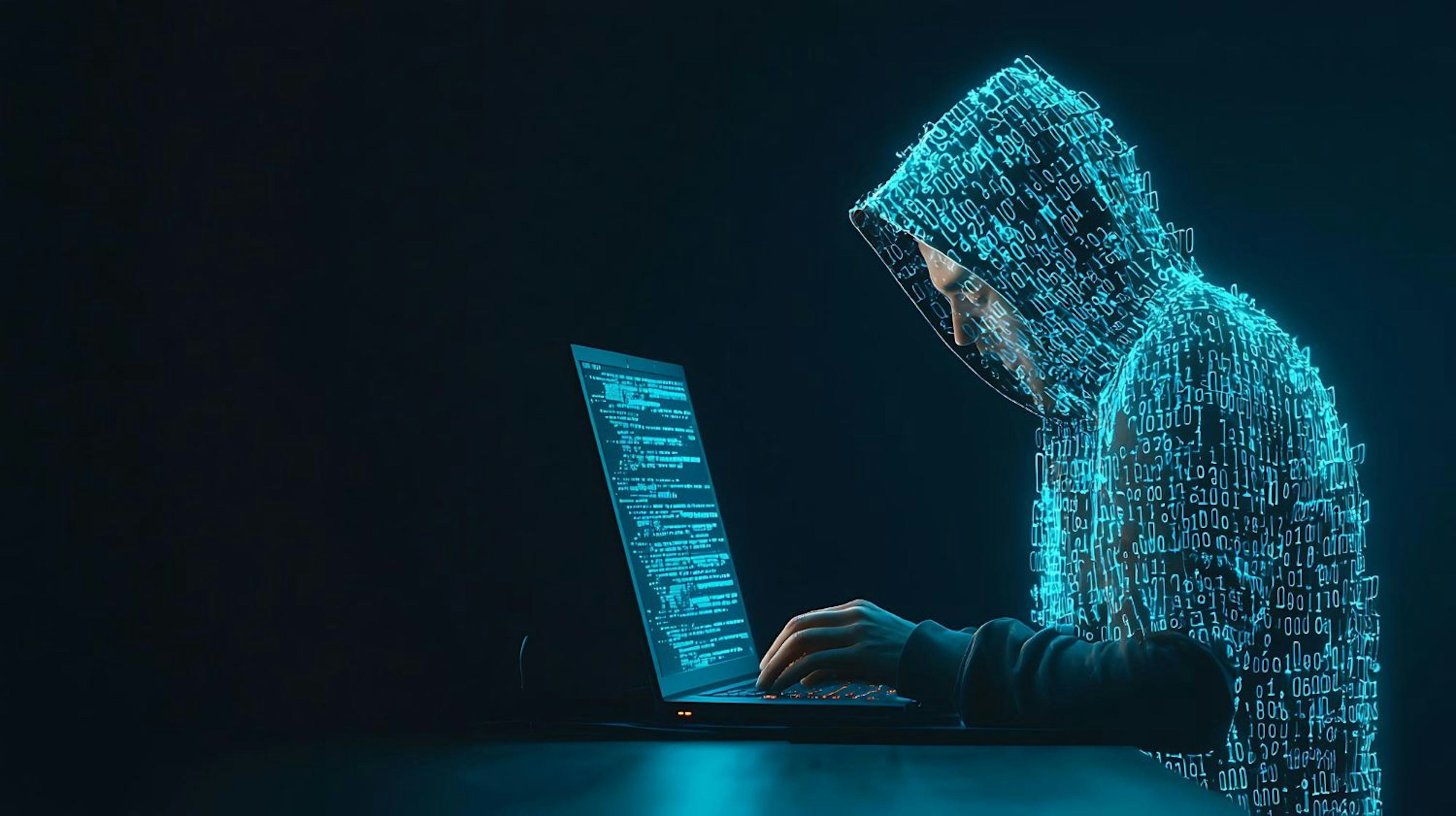 A shadowy figure hacking into a computer representing a scammer in action copy space