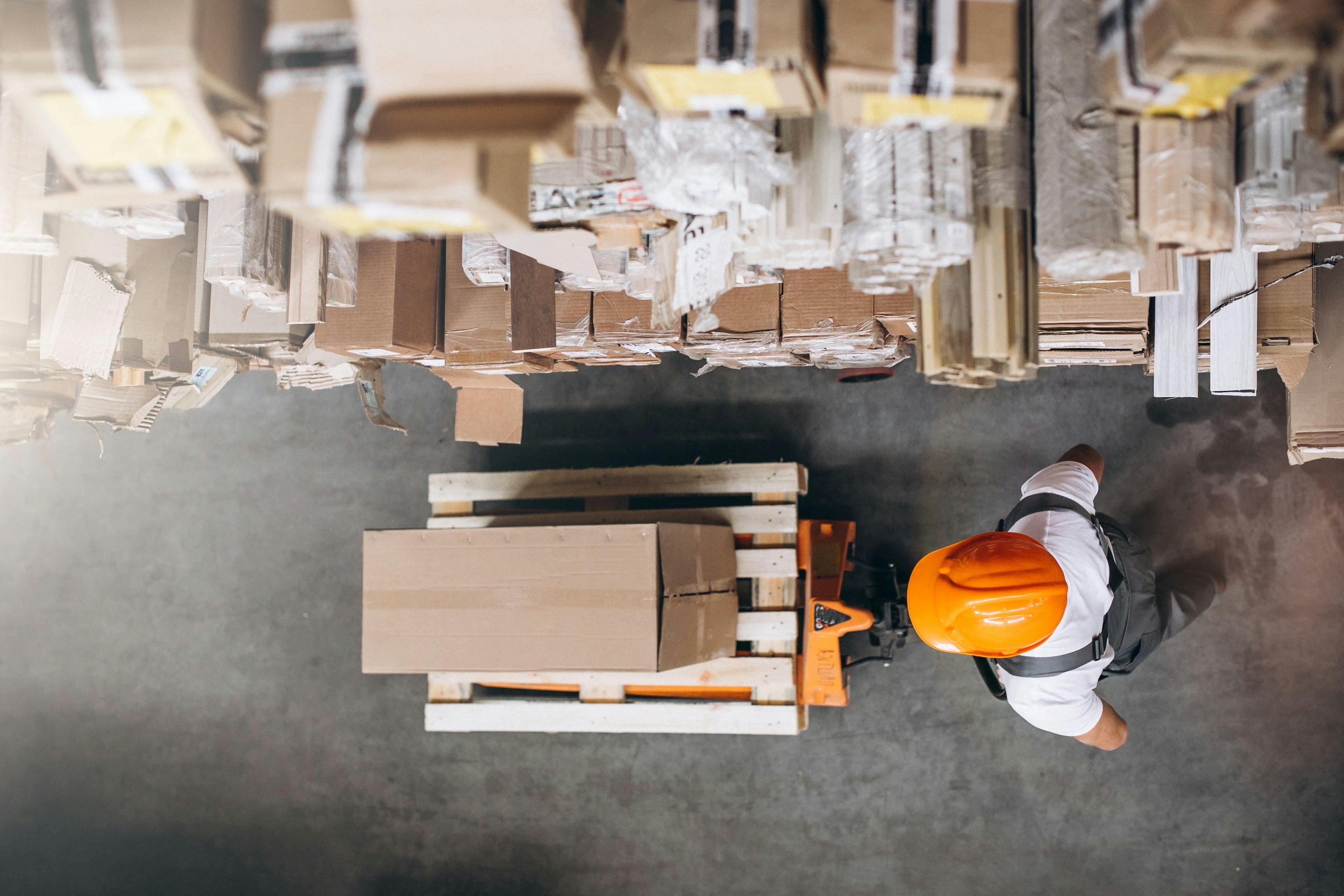 aerial view of worker at a warehouse with boxes