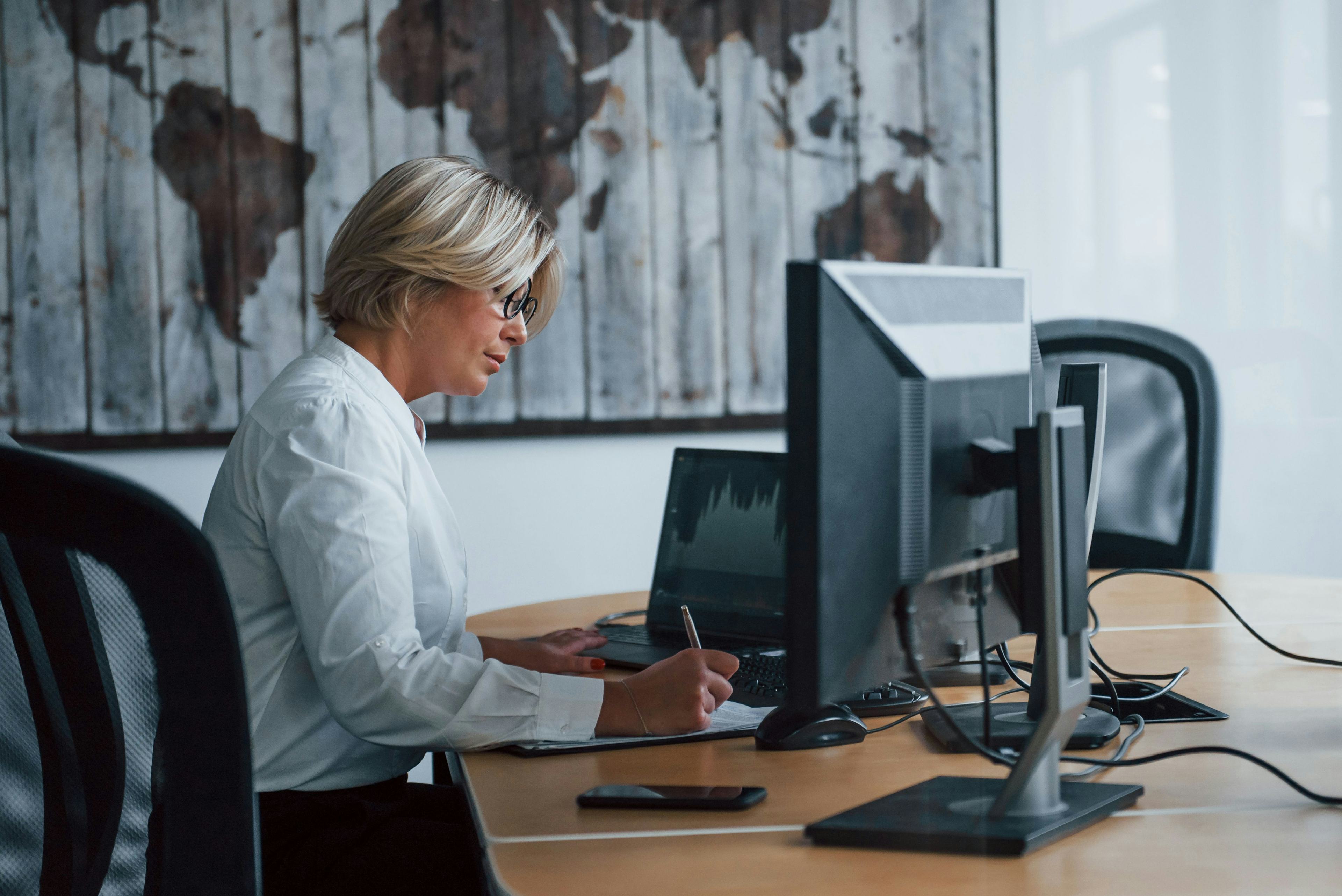 professional woman working on a desktop computer