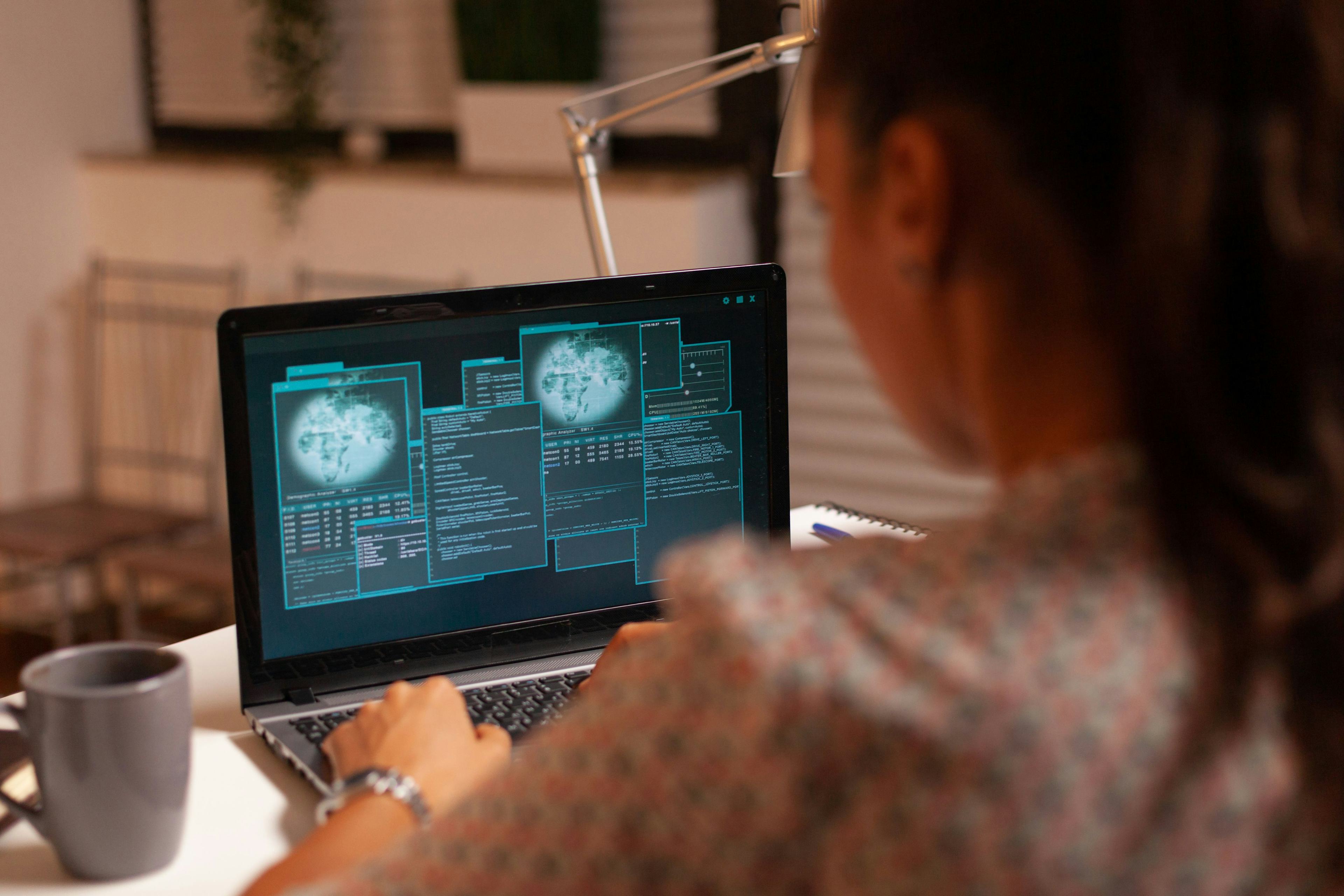 A woman looking at data on a computer