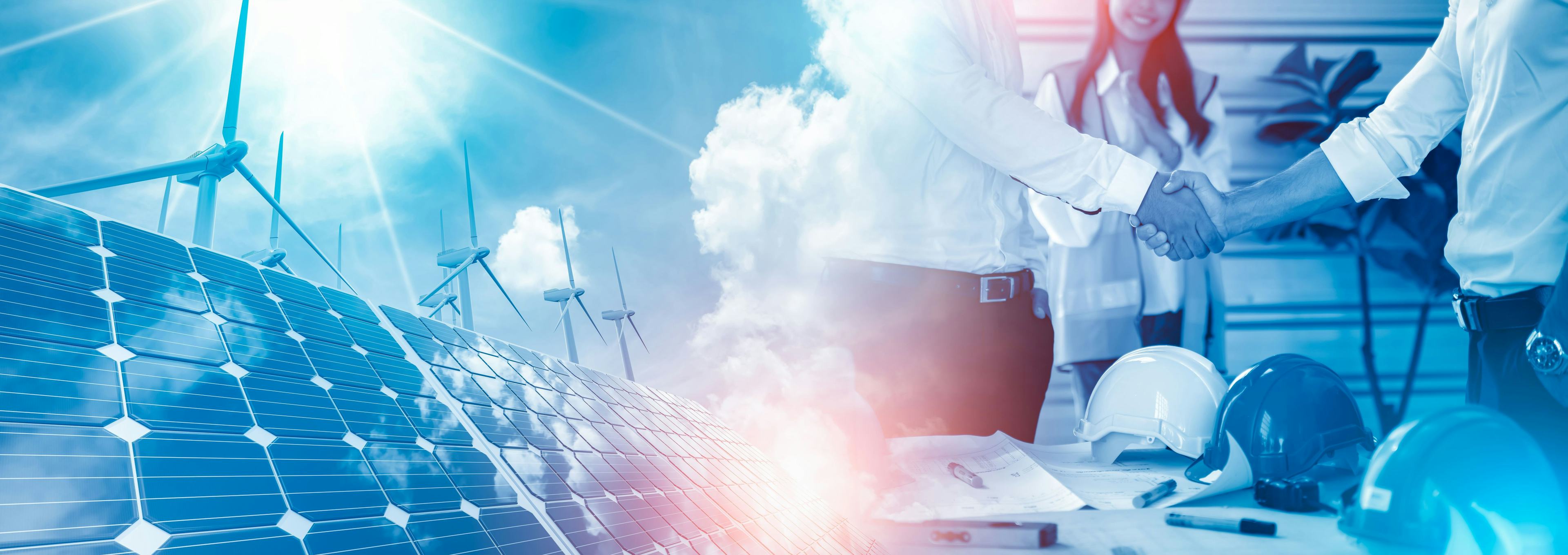 wind turbines and solar panels with two men shaking hands