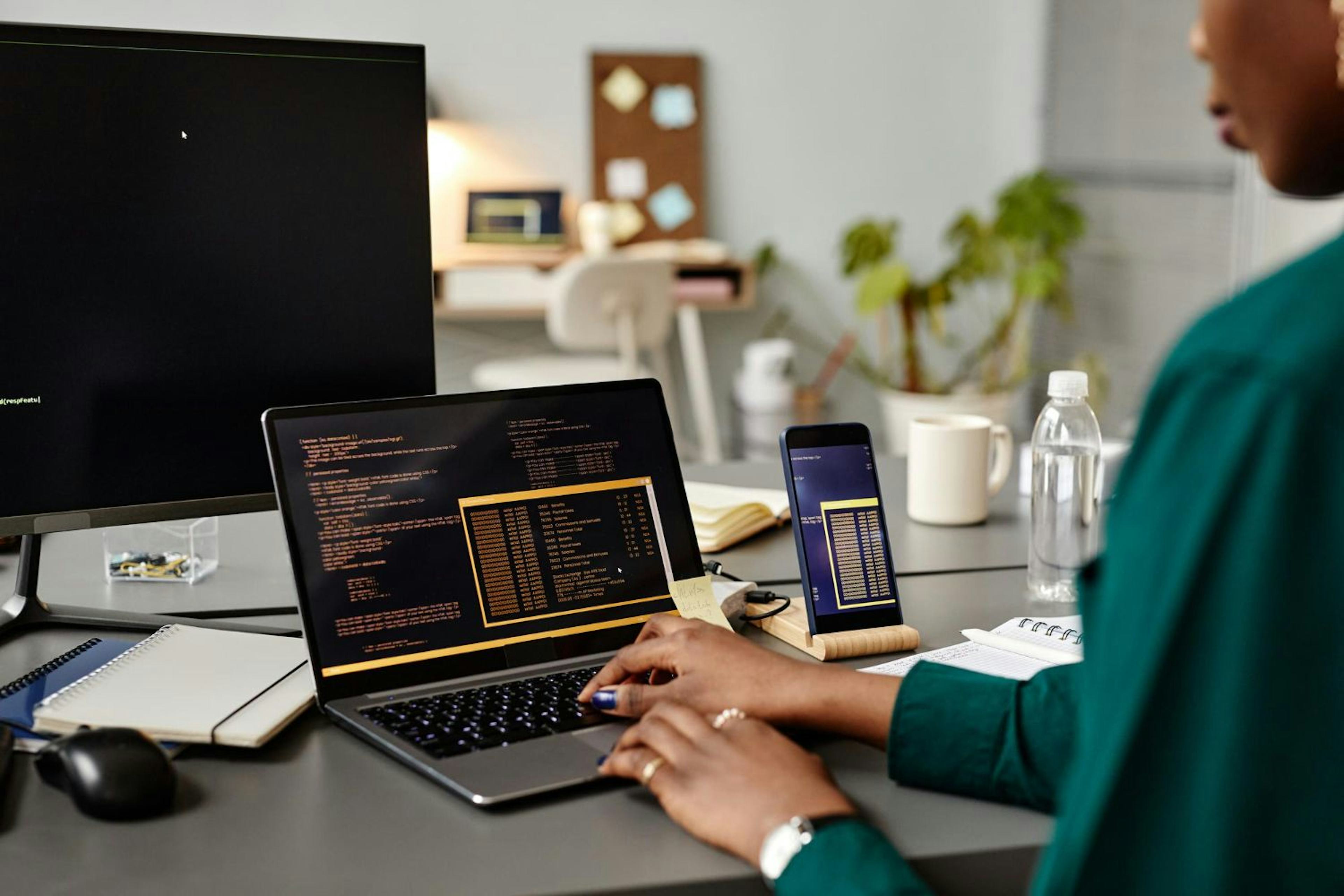 Person tying on laptop