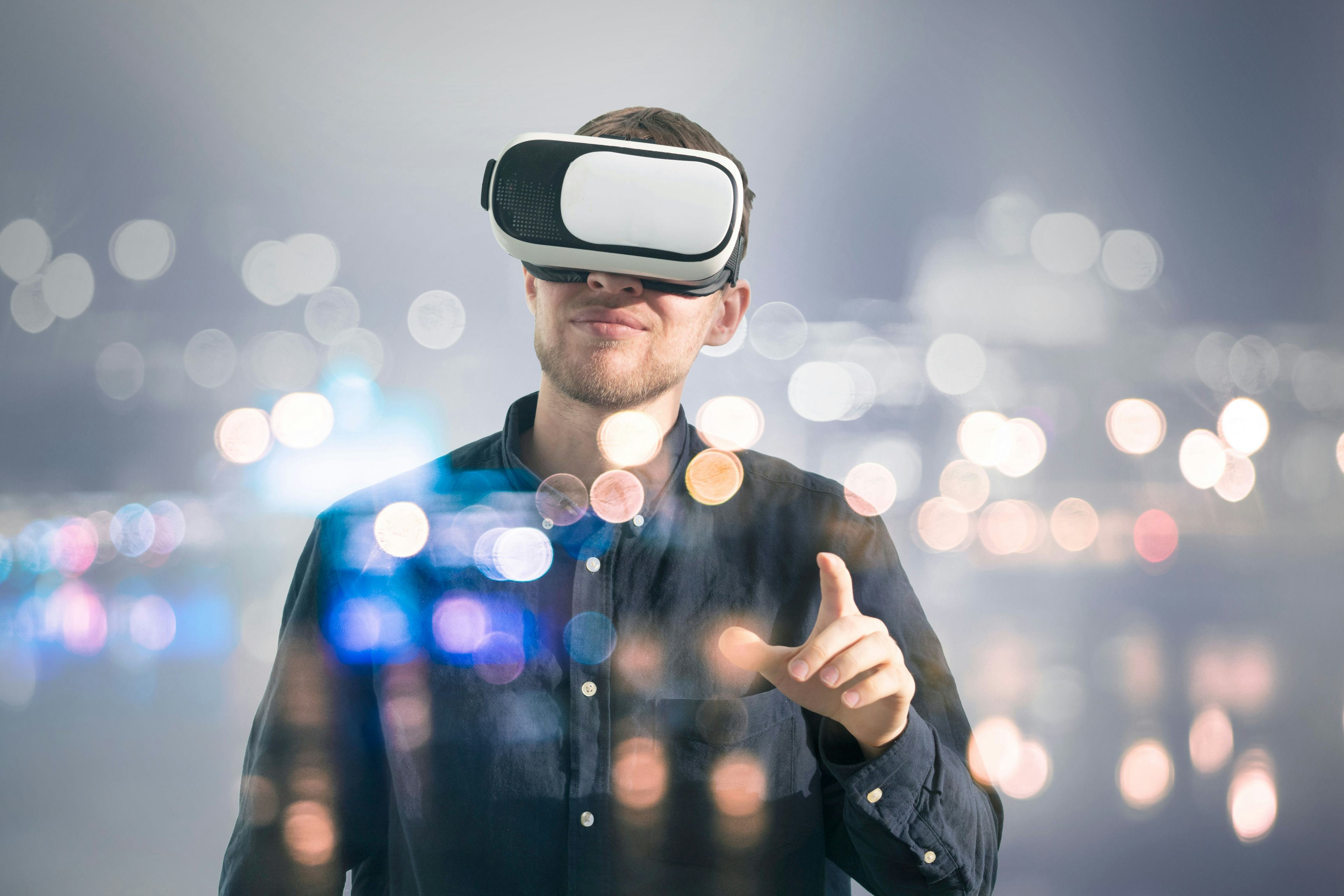 Man wearing a VR headset and pointing.