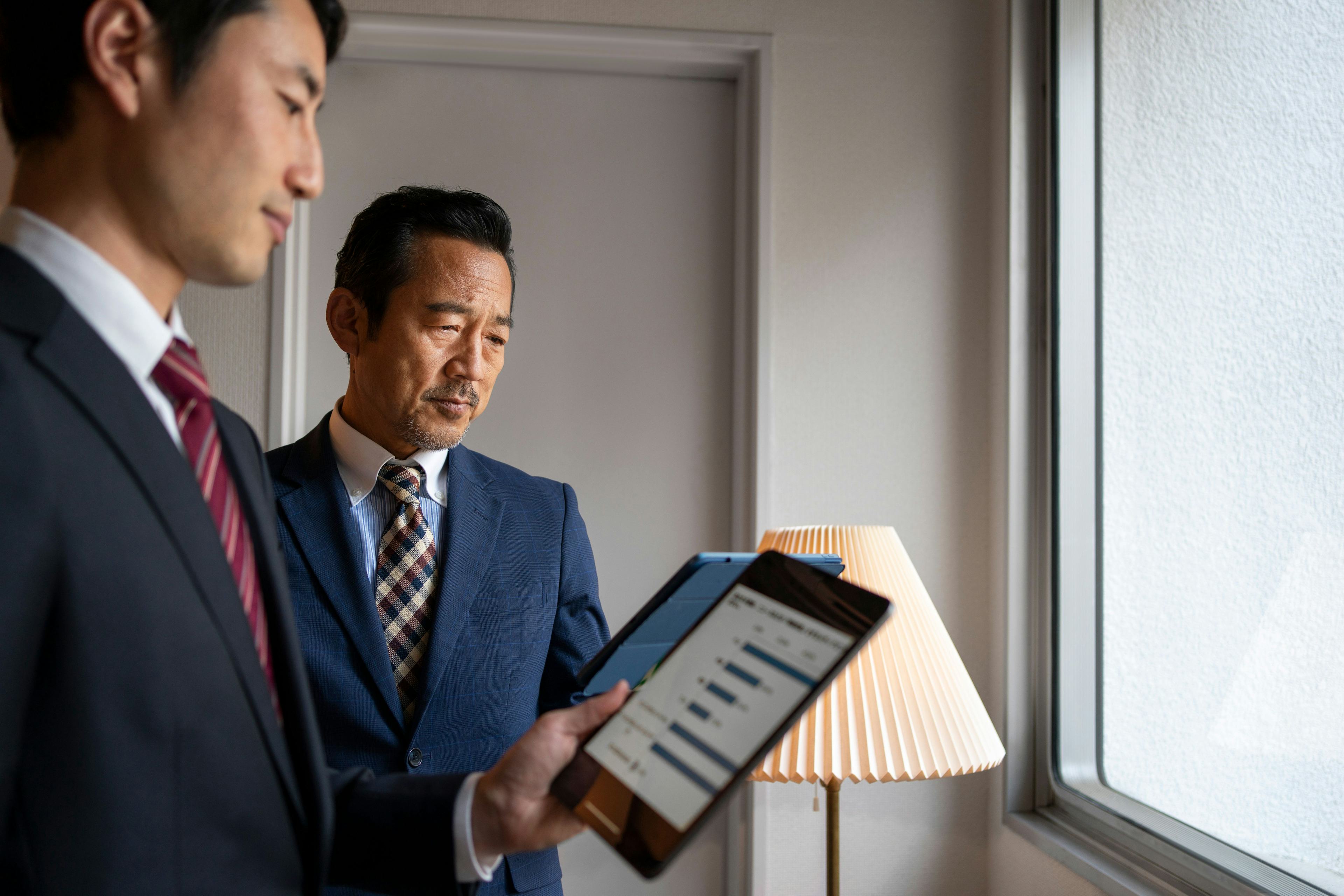 Business people working with ipad side view