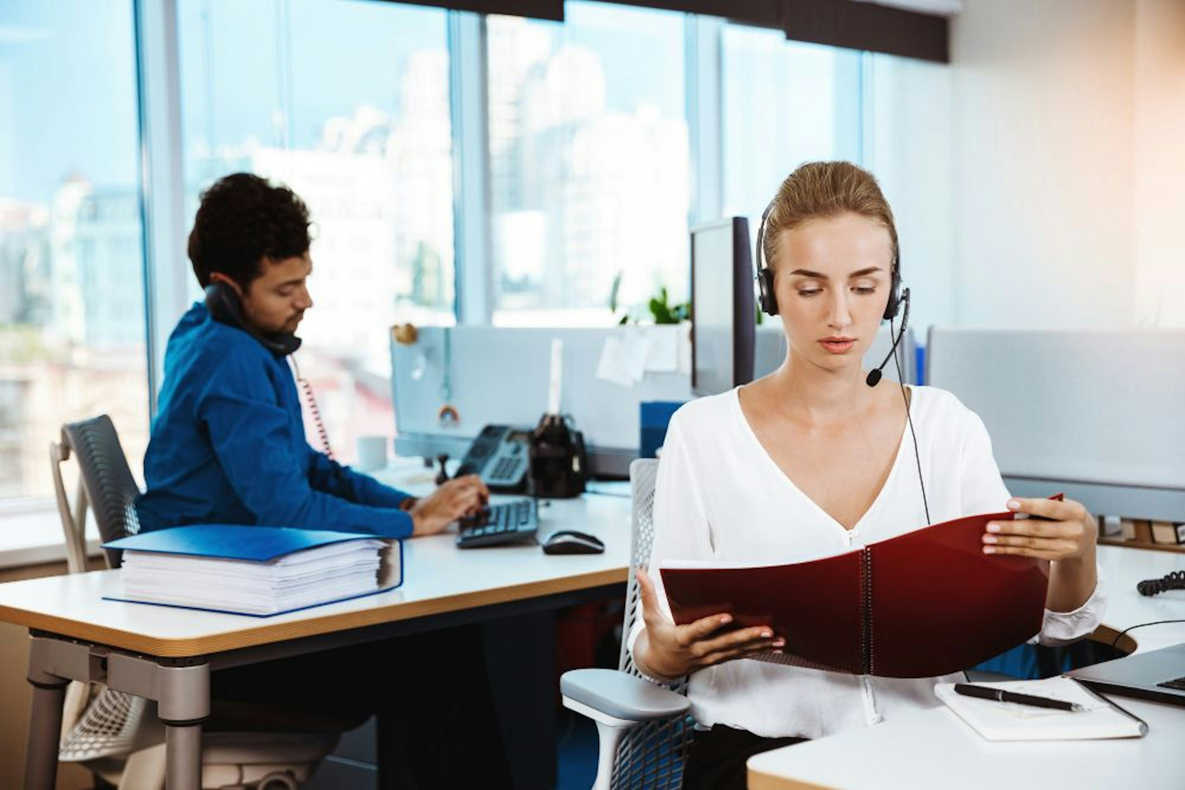 male and female support phone operator