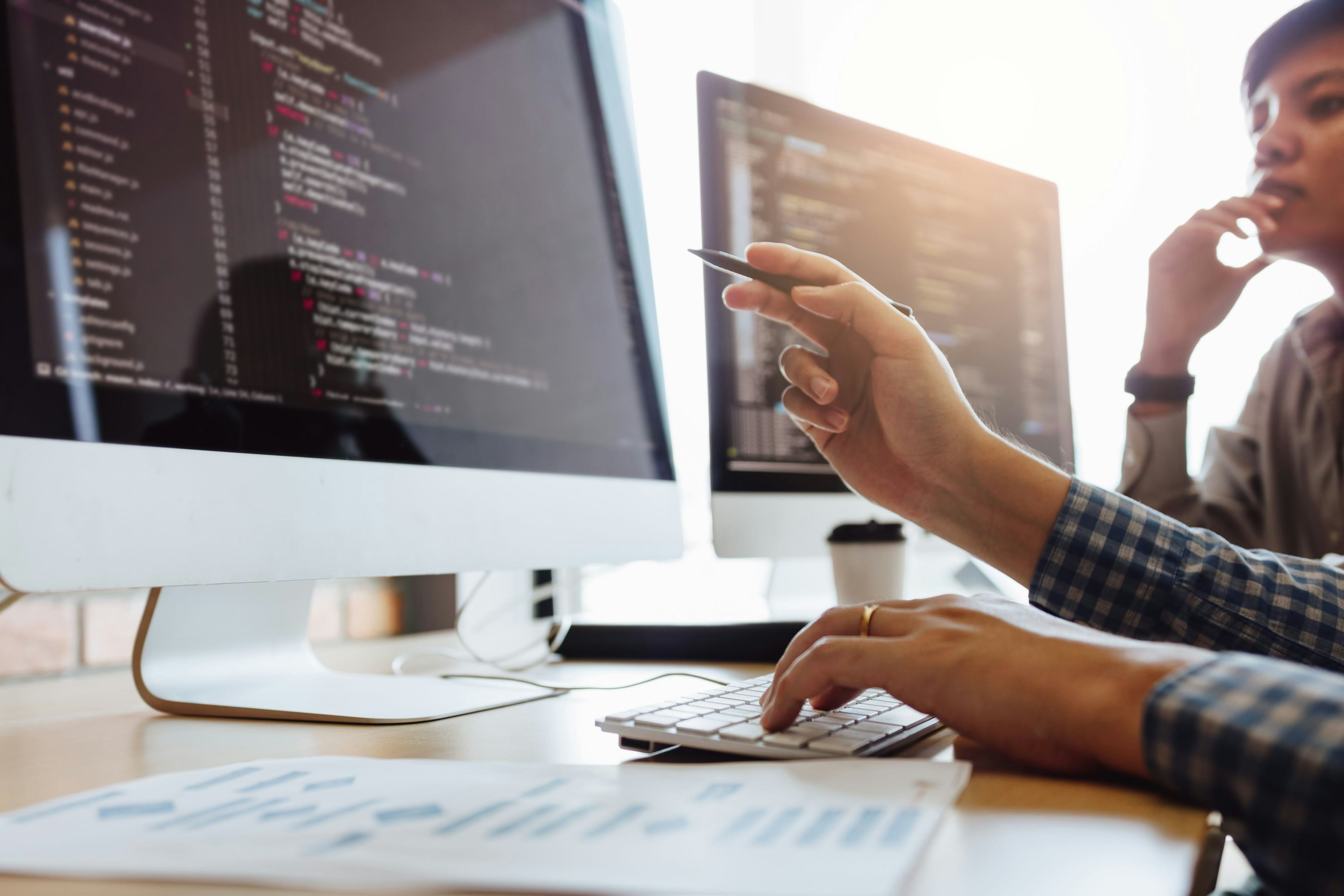 Engineers looking at a screen