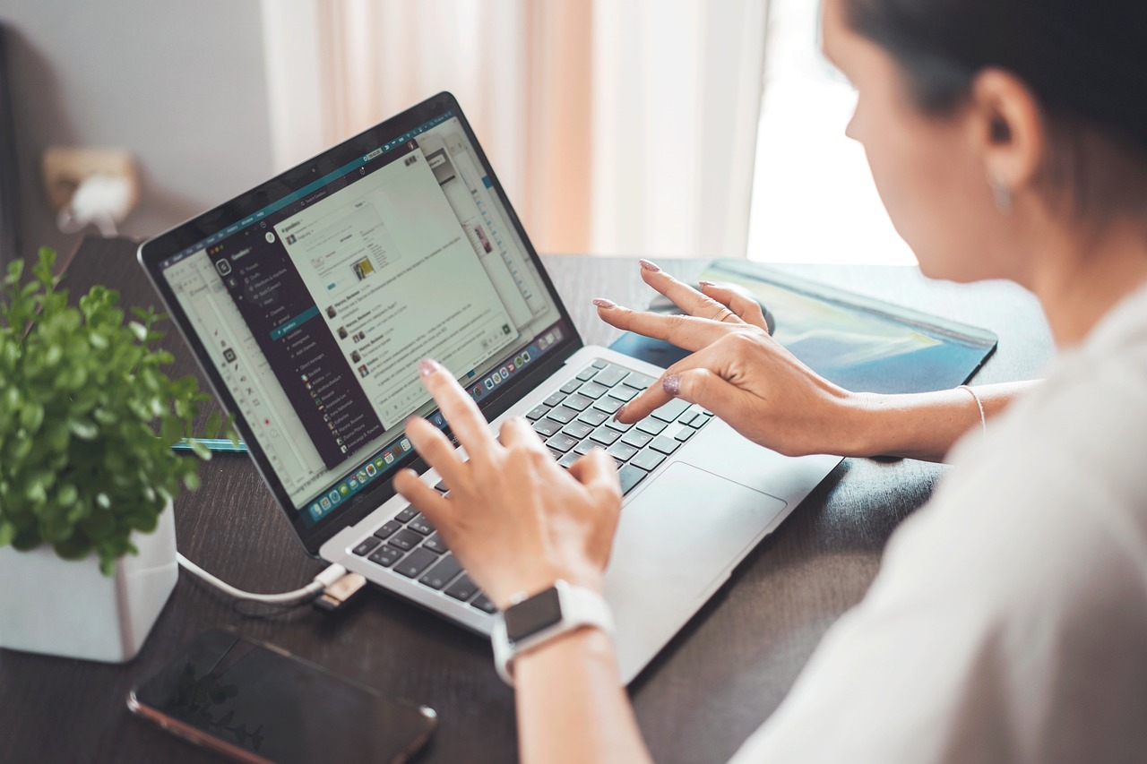 Woman working remotely from home on laptop